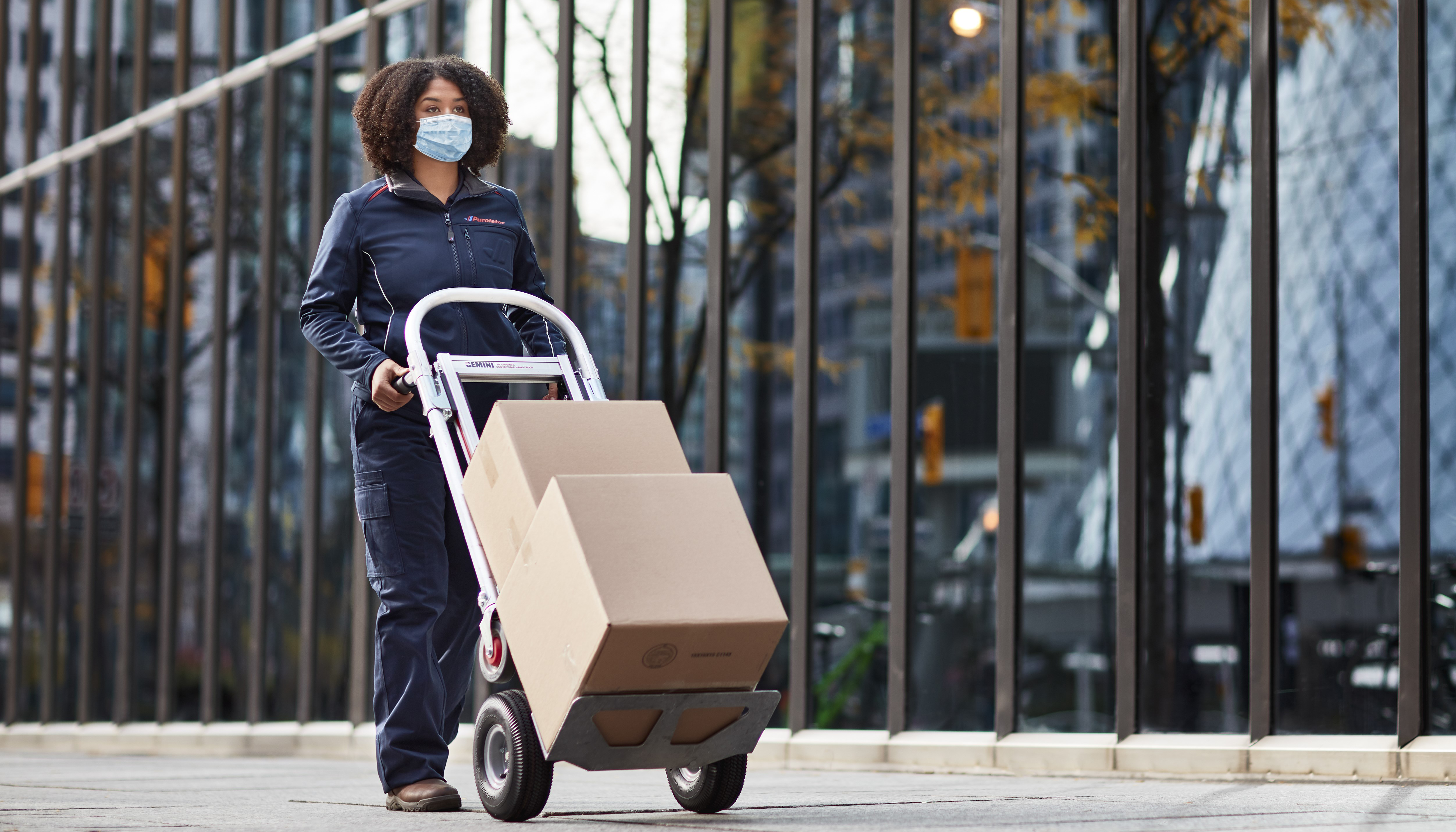 Worker pushing trolley